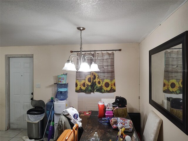 1423 17th Ave E, Bradenton, FL 34208 - dining space featuring a chandelier and a textured ceiling