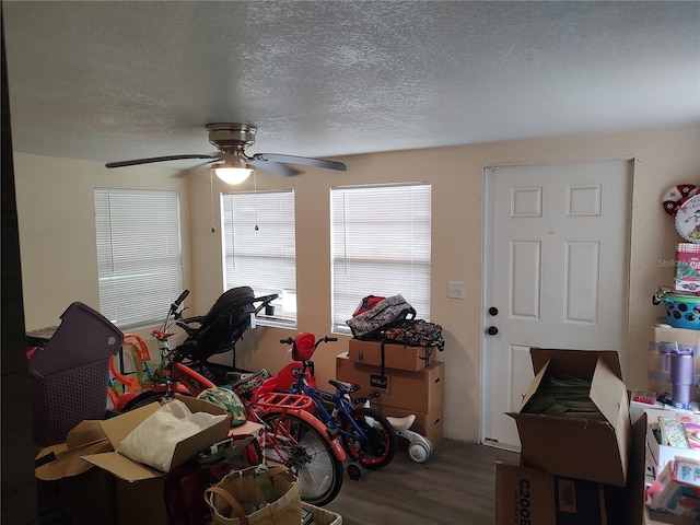 1423 17th Ave E, Bradenton, FL 34208 - rec room with wood finished floors, ceiling fan, and a textured ceiling