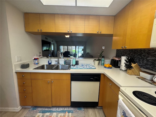 1999 Kings Hwy Unit 26A, Punta Gorda, FL 33980 - kitchen featuring white appliances, light wood finished floors, and light countertops