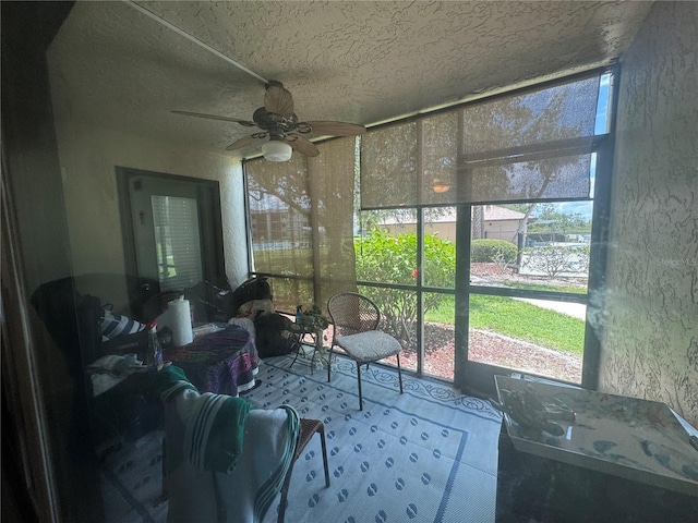 1999 Kings Hwy Unit 26A, Punta Gorda, FL 33980 - sunroom with a ceiling fan and healthy amount of natural light