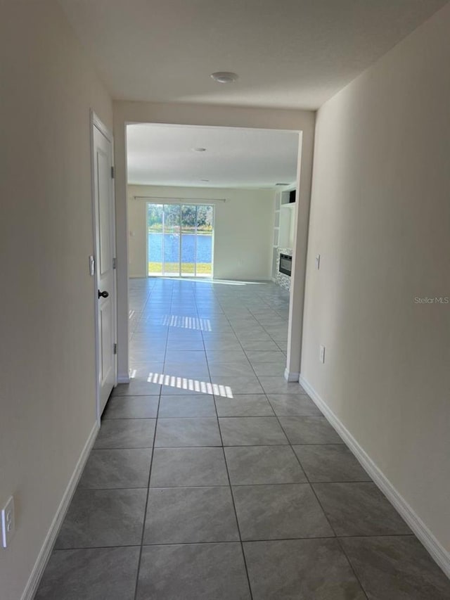 2824 Rock Sound St, Bradenton, FL 34208 - corridor with tile patterned flooring and baseboards