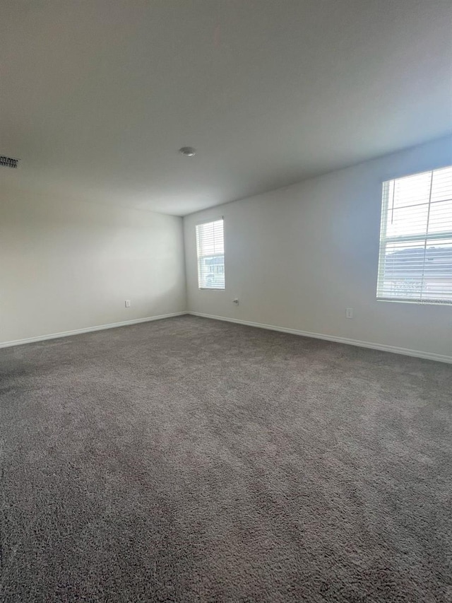 2824 Rock Sound St, Bradenton, FL 34208 - carpeted spare room featuring baseboards