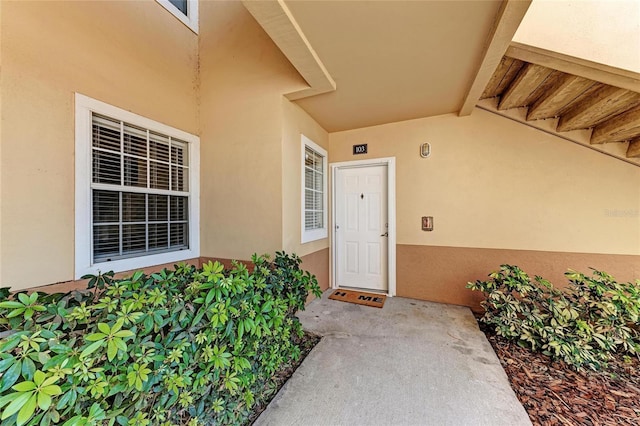 1030 Villagio Cir Unit 103, Sarasota, FL 34237 - doorway to property featuring stucco siding