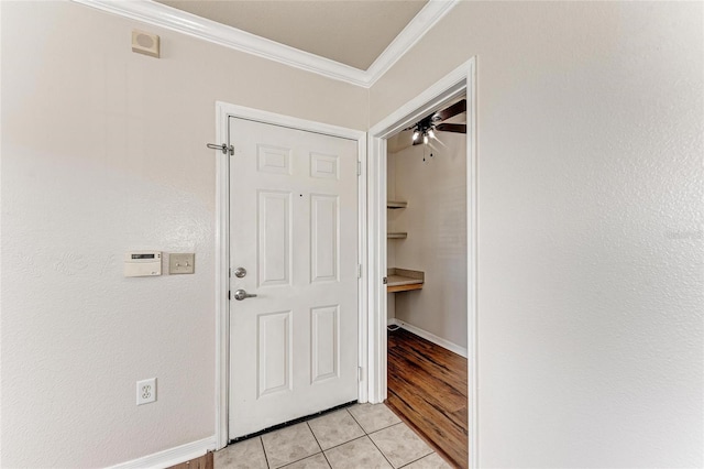 1030 Villagio Cir Unit 103, Sarasota, FL 34237 - hallway featuring crown molding and light tile patterned floors