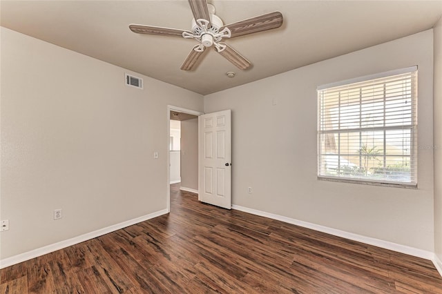 1030 Villagio Cir Unit 103, Sarasota, FL 34237 - spare room with dark wood finished floors and ceiling fan