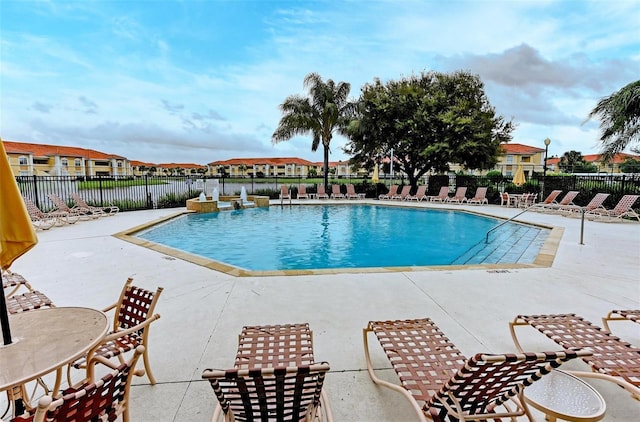 1030 Villagio Cir Unit 103, Sarasota, FL 34237 - community pool featuring a patio area