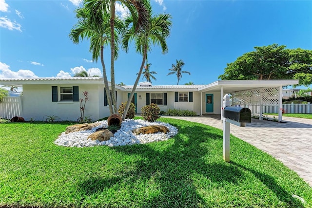 726 Jungle Queen Way, Longboat Key, FL 34228 - single story home featuring a carport, stucco siding, and driveway