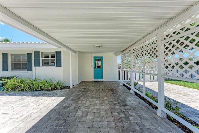 726 Jungle Queen Way, Longboat Key, FL 34228 - view of patio / terrace featuring a carport