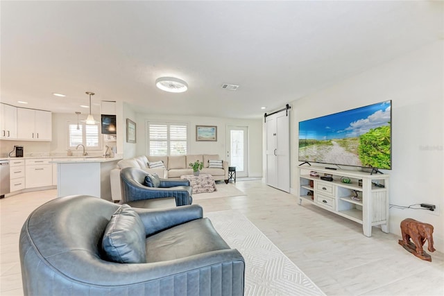 726 Jungle Queen Way, Longboat Key, FL 34228 - living area with a barn door and recessed lighting