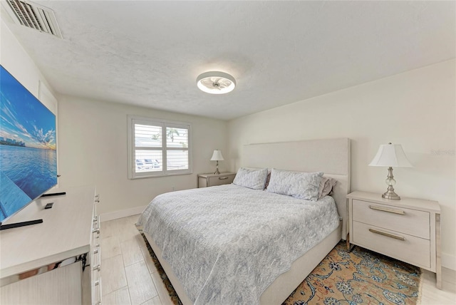 726 Jungle Queen Way, Longboat Key, FL 34228 - bedroom featuring baseboards