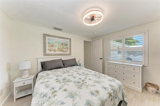 726 Jungle Queen Way, Longboat Key, FL 34228 - bedroom with baseboards and light wood-style floors
