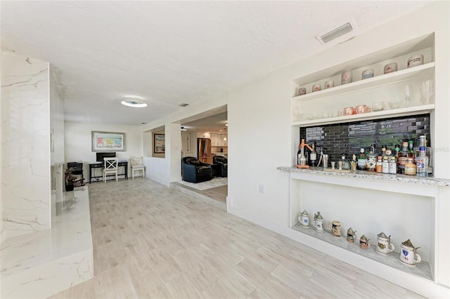 726 Jungle Queen Way, Longboat Key, FL 34228 - bar with a textured ceiling