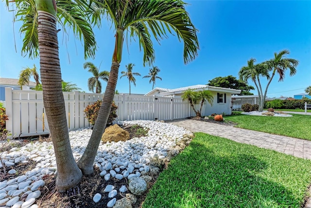 726 Jungle Queen Way, Longboat Key, FL 34228 - view of side of home featuring driveway and stucco siding