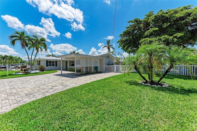 726 Jungle Queen Way, Longboat Key, FL 34228 - back of house featuring decorative driveway and stucco siding
