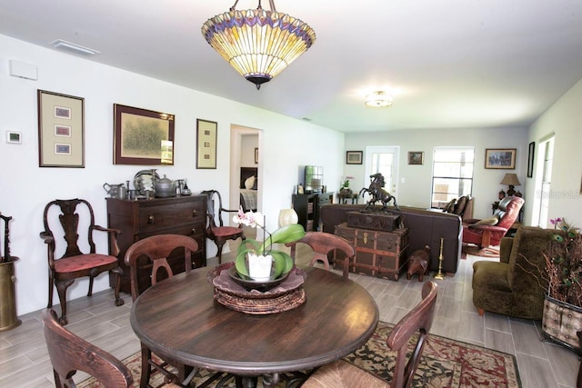 6504 Heritage Ln Unit 99, Bradenton, FL 34209 - dining area featuring wood tiled floors