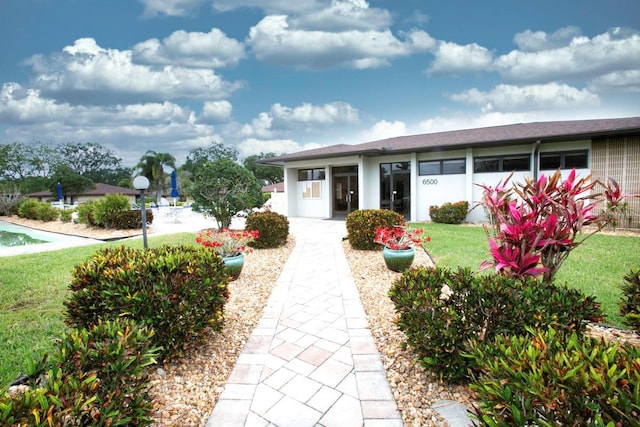 6504 Heritage Ln Unit 99, Bradenton, FL 34209 - view of front facade with a front yard