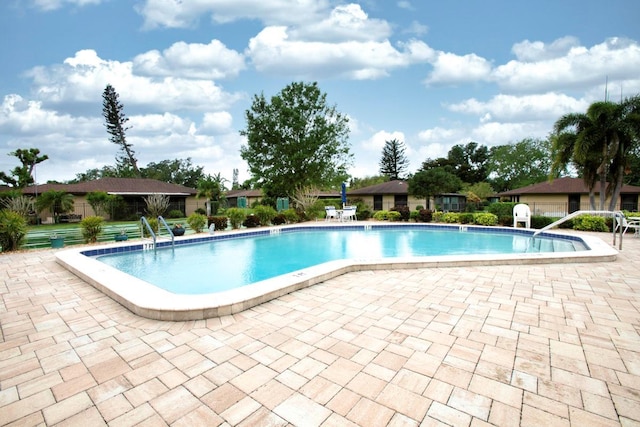 6504 Heritage Ln Unit 99, Bradenton, FL 34209 - community pool with a patio area