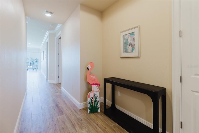 501 Tamiami Trl N Unit 201, Venice, FL 34285 - corridor featuring wood finished floors and crown molding