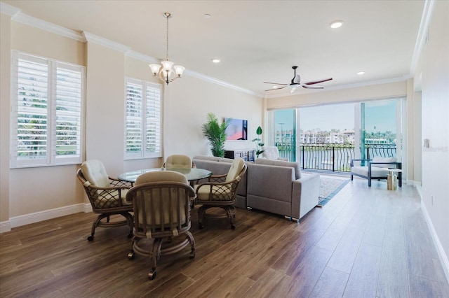 501 Tamiami Trl N Unit 201, Venice, FL 34285 - dining space with wood finished floors, a ceiling fan, ornamental molding, recessed lighting, and a chandelier