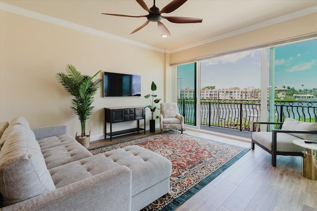 501 Tamiami Trl N Unit 201, Venice, FL 34285 - living area featuring a ceiling fan, ornamental molding, wood finished floors, and recessed lighting