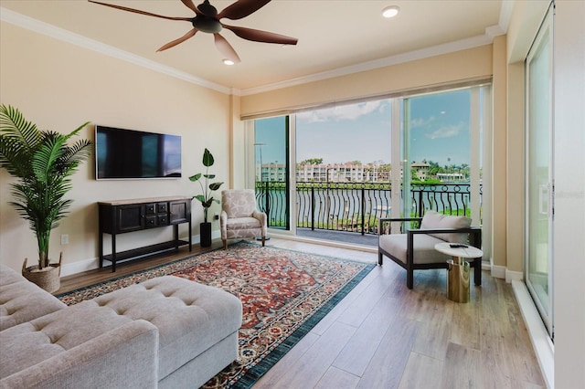 501 Tamiami Trl N Unit 201, Venice, FL 34285 - living area with wood finished floors, a ceiling fan, ornamental molding, and recessed lighting