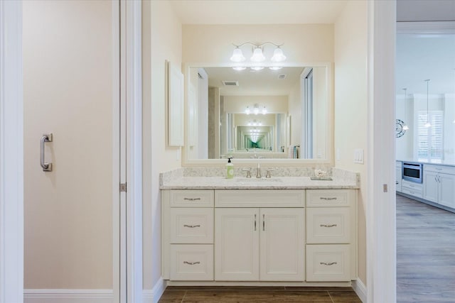 501 Tamiami Trl N Unit 201, Venice, FL 34285 - bathroom featuring vanity and wood finished floors