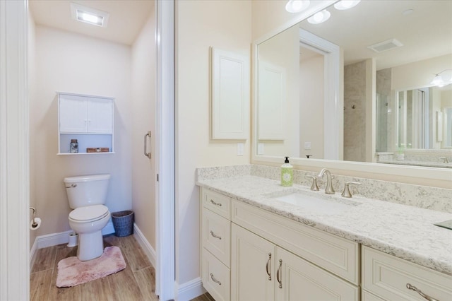 501 Tamiami Trl N Unit 201, Venice, FL 34285 - bathroom with vanity and wood finished floors