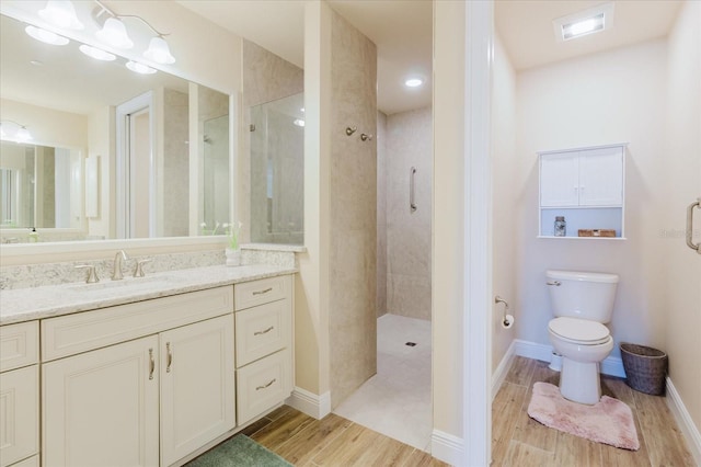 501 Tamiami Trl N Unit 201, Venice, FL 34285 - bathroom with wood finished floors, walk in shower, and vanity
