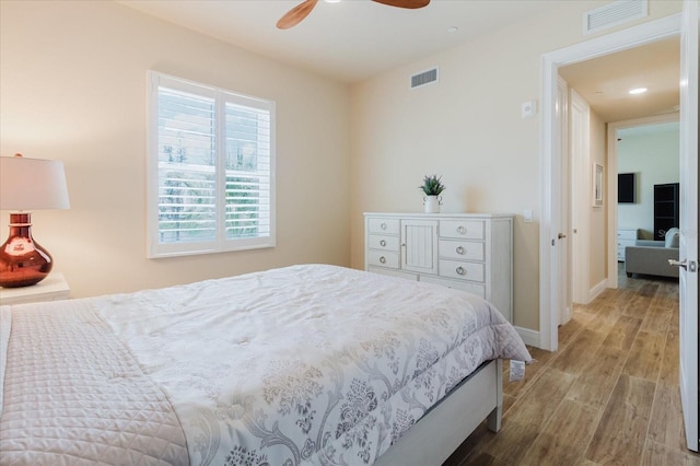 501 Tamiami Trl N Unit 201, Venice, FL 34285 - bedroom featuring wood finished floors, ceiling fan, and recessed lighting