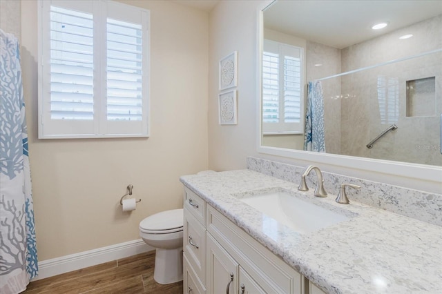 501 Tamiami Trl N Unit 201, Venice, FL 34285 - full bath with vanity, wood finished floors, and a shower with shower curtain