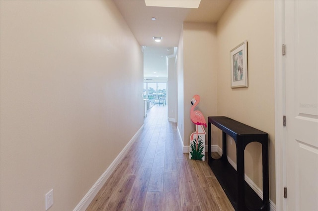 501 Tamiami Trl N Unit 201, Venice, FL 34285 - hallway with light wood-type flooring and baseboards