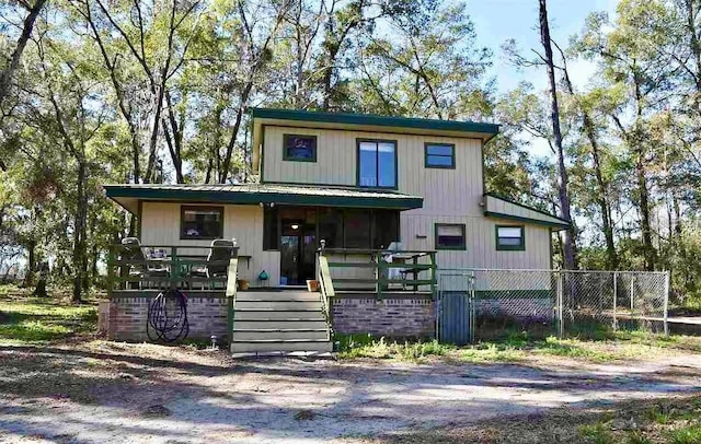 1123 NW 192nd Ave, Gainesville, FL 32609 - view of front of home with a porch and a metal roof