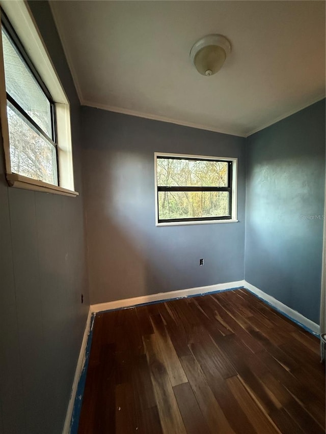 1123 NW 192nd Ave, Gainesville, FL 32609 - empty room with hardwood / wood-style flooring and crown molding