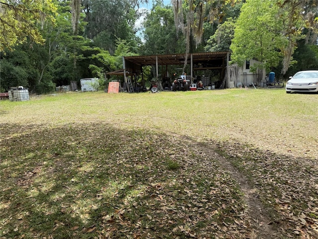 1123 NW 192nd Ave, Gainesville, FL 32609 - view of green lawn with a carport