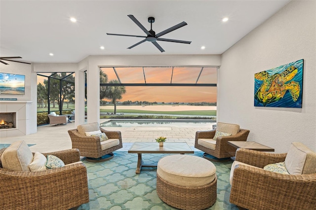 3968 Santa Caterina Blvd, Bradenton, FL 34211 - living room with a ceiling fan, recessed lighting, and a tile fireplace