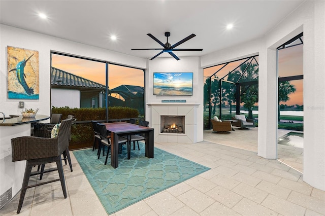 3968 Santa Caterina Blvd, Bradenton, FL 34211 - dining space featuring a ceiling fan, recessed lighting, and a fireplace