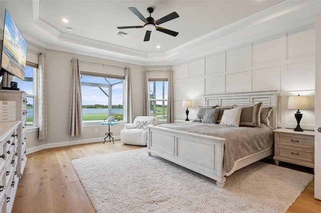 3968 Santa Caterina Blvd, Bradenton, FL 34211 - bedroom featuring a tray ceiling, ornamental molding, light wood-style flooring, recessed lighting, and ceiling fan
