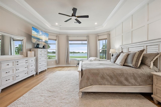 3968 Santa Caterina Blvd, Bradenton, FL 34211 - bedroom featuring a raised ceiling, light wood-style floors, ornamental molding, and ceiling fan