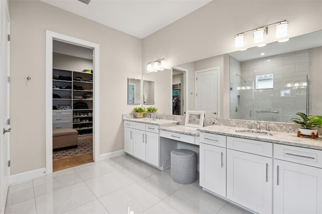 3968 Santa Caterina Blvd, Bradenton, FL 34211 - bathroom with a spacious closet, a shower stall, vanity, and tile patterned flooring