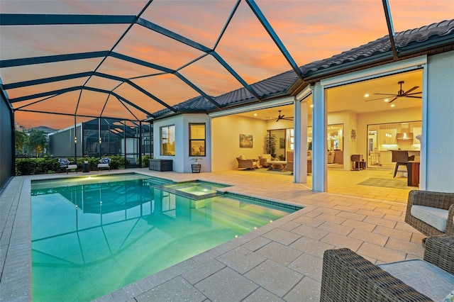 3968 Santa Caterina Blvd, Bradenton, FL 34211 - pool at dusk with a ceiling fan, a patio area, a pool with connected hot tub, and a lanai