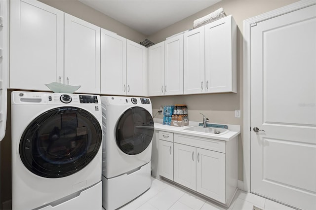 3968 Santa Caterina Blvd, Bradenton, FL 34211 - washroom with separate washer and dryer, cabinet space, and light tile patterned floors