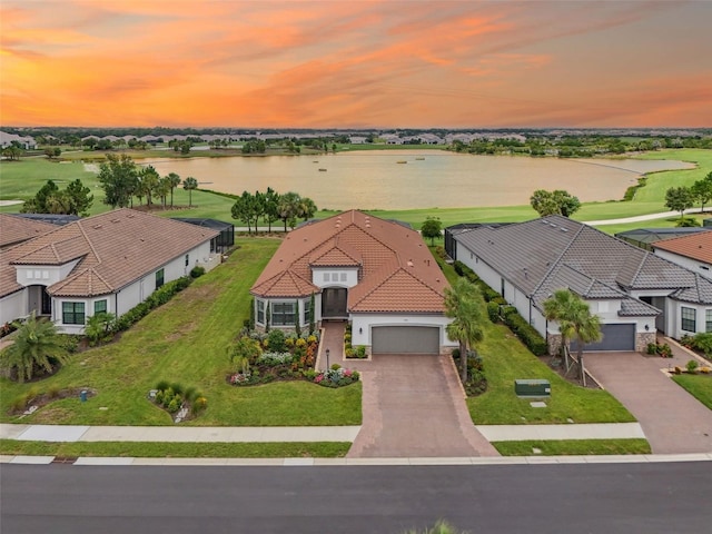 3968 Santa Caterina Blvd, Bradenton, FL 34211 - aerial view at dusk of a water view, a residential view, and golf course view