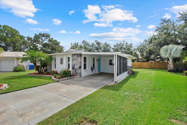 4309 Chinaberry Cir, Bradenton, FL 34208 - ranch-style home featuring driveway, stone siding, a carport, and stucco siding