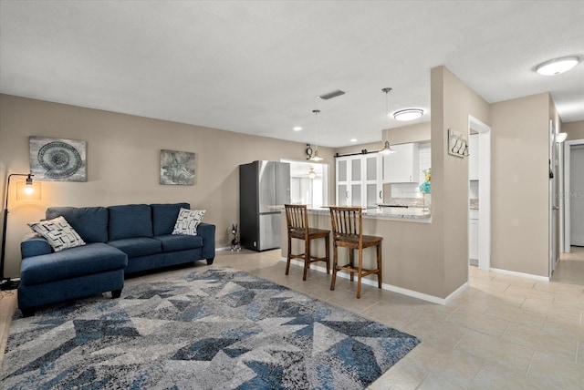4309 Chinaberry Cir, Bradenton, FL 34208 - living room with baseboards and light tile patterned floors