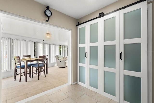 4309 Chinaberry Cir, Bradenton, FL 34208 - dining area featuring tile patterned flooring and a barn door