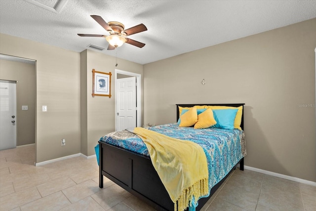 4309 Chinaberry Cir, Bradenton, FL 34208 - bedroom with light tile patterned floors, a textured ceiling, and ceiling fan