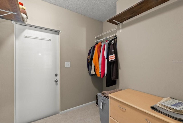 4309 Chinaberry Cir, Bradenton, FL 34208 - walk in closet featuring light tile patterned floors