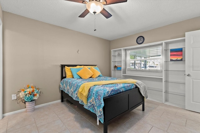 4309 Chinaberry Cir, Bradenton, FL 34208 - bedroom with a textured ceiling, light tile patterned flooring, and ceiling fan