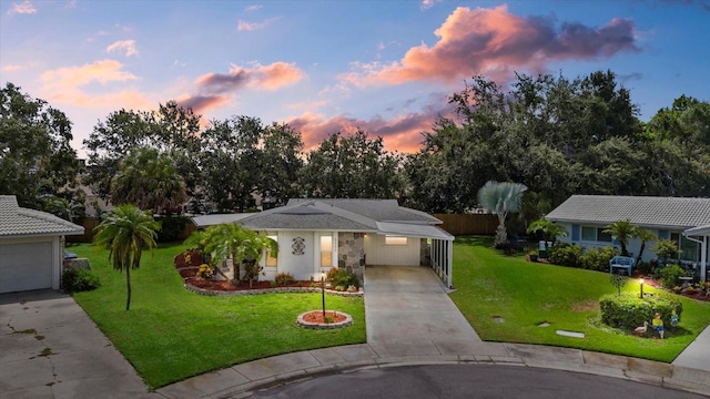 4309 Chinaberry Cir, Bradenton, FL 34208 - view of front of property featuring concrete driveway, a carport, and stucco siding