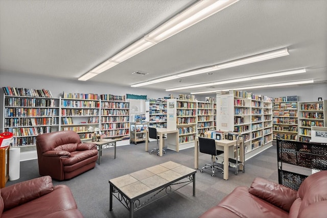 4309 Chinaberry Cir, Bradenton, FL 34208 - carpeted living room featuring wall of books and a textured ceiling